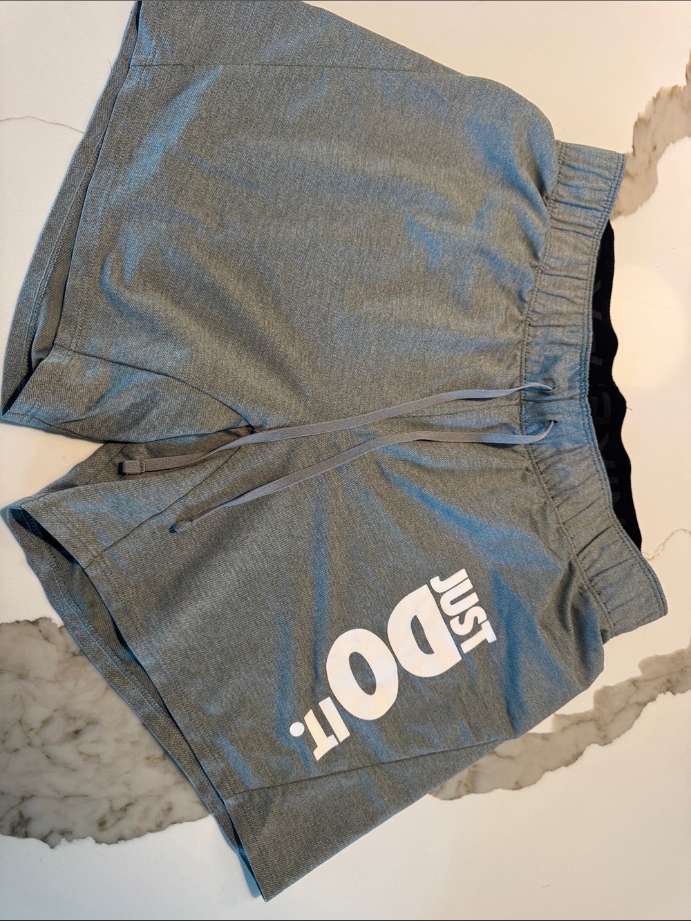 Nike Grey Athletic Shorts with White 'Just Do It' Logo